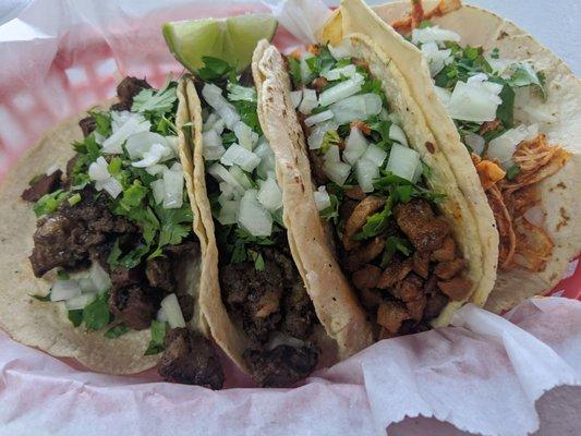 Steak, spicy pork and chicken tacos