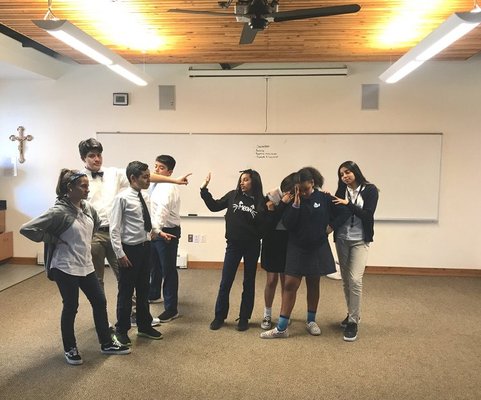 Students at St. Andrew Nativity working with Founder, David Koff on one of his tableau exercises.