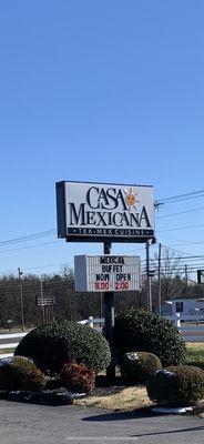 Road sign showing the restaurant is Tex-Mex... and the buffet hours