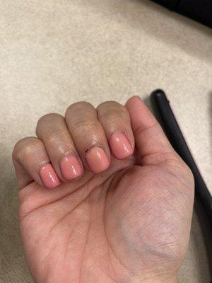 A nick on the pinky and middle finger. The color looks more peachy now that the bright pink that it was the day I left the salon.