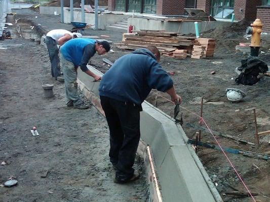 Crew finishing barrier curb @ WWU