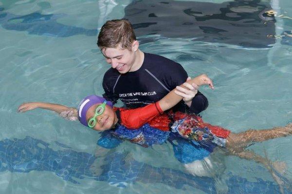 Staff teaching proper stroke position