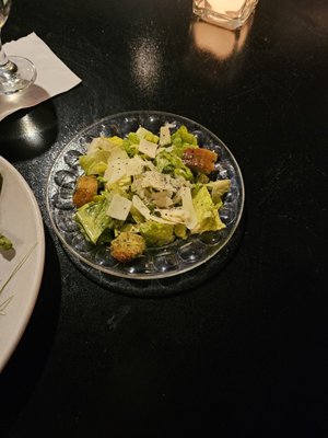 Caesar salad with homemade croutons  and fresh parmesan slices.