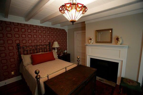 The Polk room. Full sized bed, can sleep 1-2 Guests. Private bathroom with Standup Shower