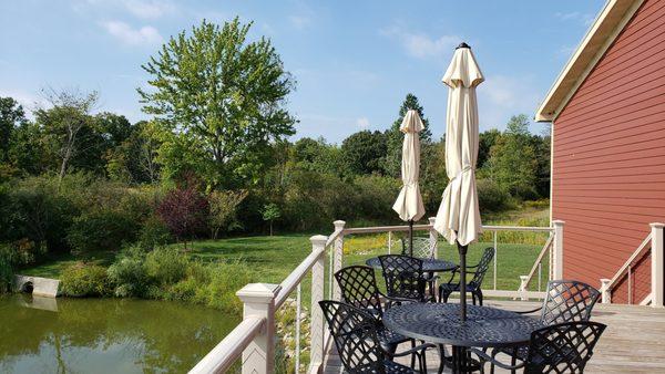 Enjoy a wood deck overlooking the property's two ponds.