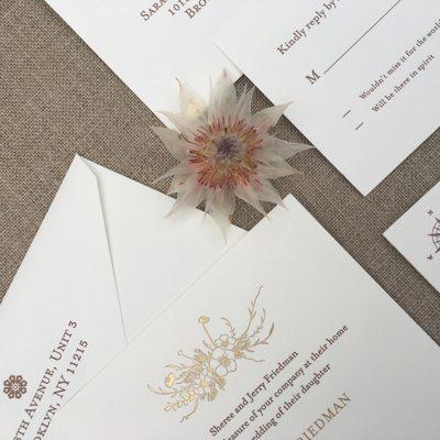 Custom gold foil wedding invitations.