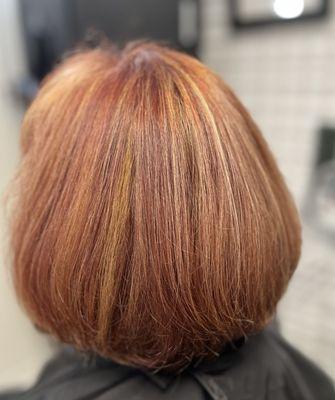 A light mahogany red with dimension and highlights.