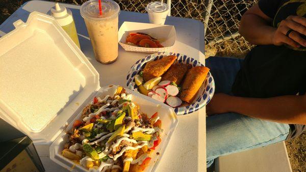 Loaded fries with carnitas, quesabirria with consume, horchata