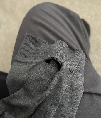 Shirt sleeve with holes in seam. Other are is the same.