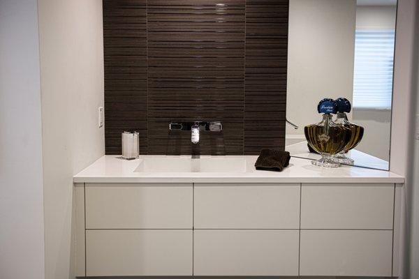 White Quartz vanity with custom fabricated integrated sink