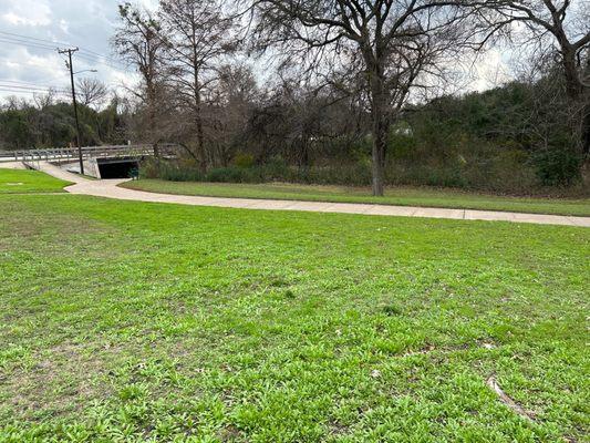 Paved bike path that runs under Railroad Ave.