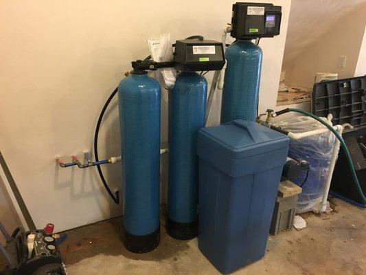 Dual water softener with air injection system for iron and sulfur.