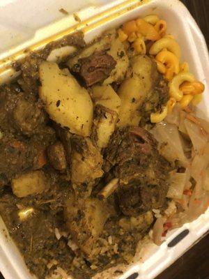 Curry Goat with rice and peas and cabbage