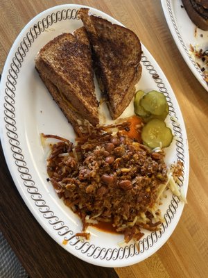 Old fashion patty melt with hash-browns scattered smothers and topped