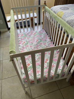 Beautiful, comfortable and safe crib for our kiddo. With adorable "Aloha" crib sheet included.