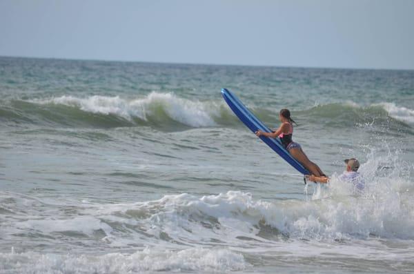 My 11 y/o learning to surf in a private lesson.