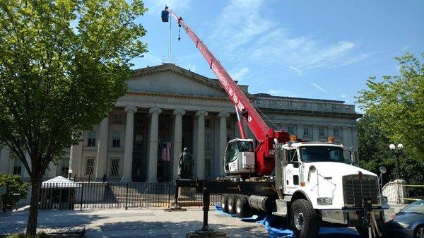 Lifting the technician to repair the flagpole over the US Treasury Building, next to the White House