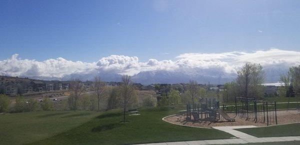 View of Wasatch with some light snow and fluffy clouds.