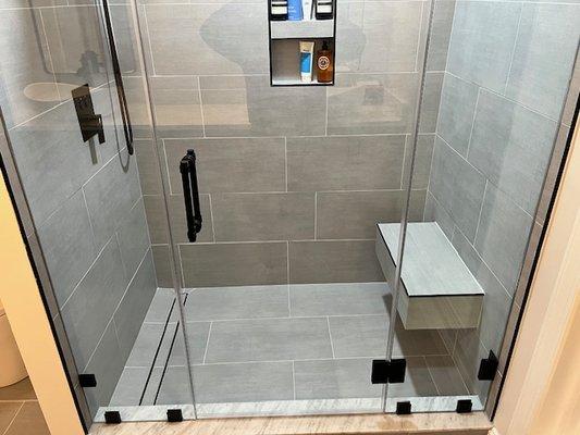 Large format Tile installed on shower floor  and walls