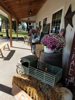 Cute decor on the seasonally decorated porch