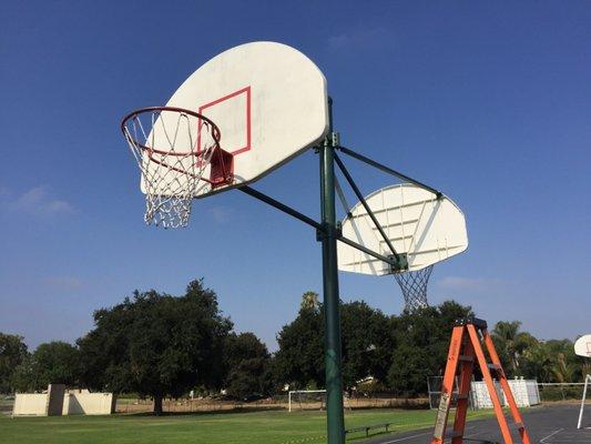 Painted basketball support poles.