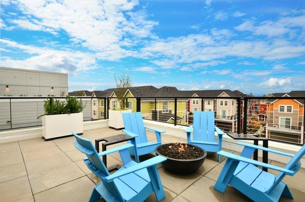 One of two roof top decks, featuring a year round fire pit.