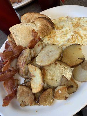 Eggs, home fries, rye toast with bacon