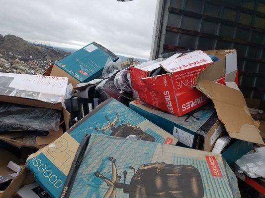 Unloading damaged items at the landfill