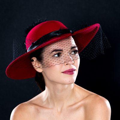 Red wool dress hat with dotted mesh and feathers