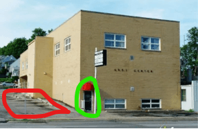 Entrance to the clinic circled in green. Parking circled in red