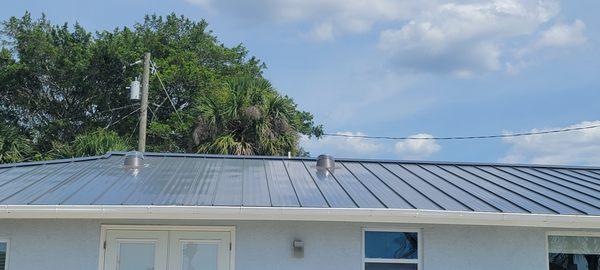 Beautiful standing seam aluminum deep grey metal roof.