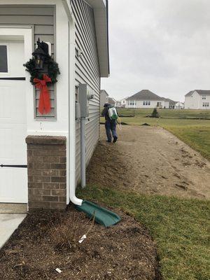 Spraying the outside of my home.