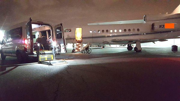 A client picked up directly off the private jet into the wheelchair transport vehicle.