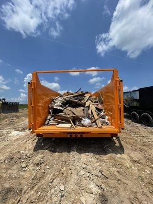 Our dumpsters have two doors that swing and lock all the way open for easy loading.