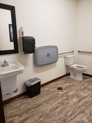 Unisex bathroom with changing station