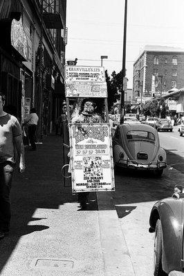 Sandwich board on Telegraph Ave., advertising new Rolling Stones album available at LEOPOLD'S. - - -Tom Brody