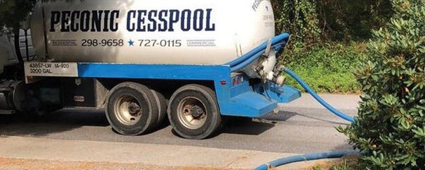 Cesspool pumping truck.