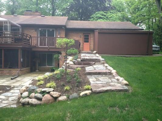 Flag stone path with ledgerock steps and boulder wall.