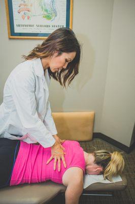 Dr. Anne uses soft tissue work to palpate and relieve muscle tension.