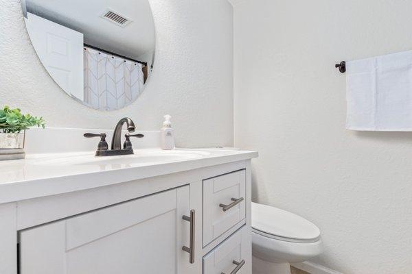 Patched walls, Painted walls, new baseboards, installed new vanity and toilet