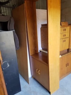 Mover picked up cabinet from the bottom toe kick and cabinet dropped out of his hands and the back broke off from the mover dropping it.