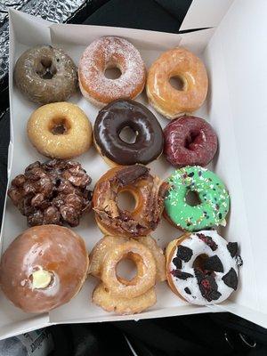 Holy DONUTS!!!! The cow looking one is an Oreo donut, the red is red velvet, and zoom in close: there's a BACON donut!!! YUMMY!