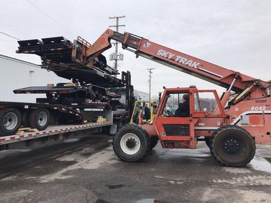 Stacking and unstacking new trailers