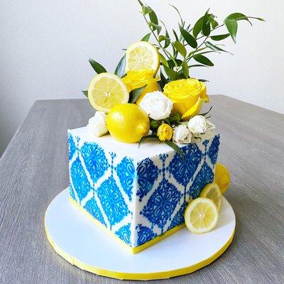 Lemon and blue tile themed baby shower cake