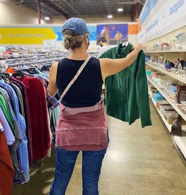 Enjoying the large selection of clothing at the Missions Thrift Store.