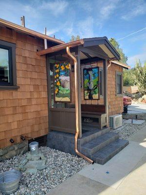 6 inch half round copper gutter with a 3 inch round downspout.