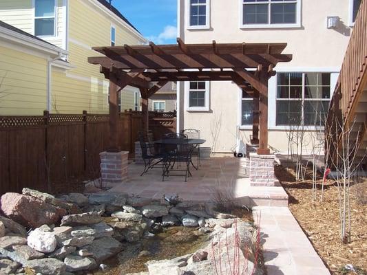 Pergola, water feature and flagstone patio