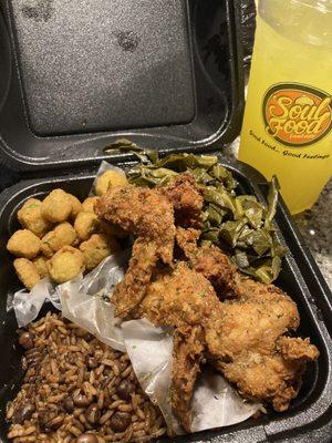 Honey chicken wings, fried okra, greens, dirty rice and a mango drink