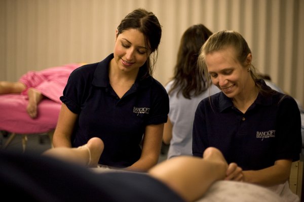 Two students working together for plantar fasciitis pathology.