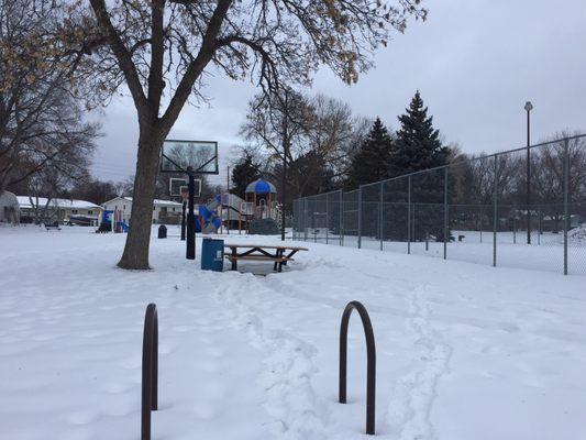 Bike parking, picnic tables, basketball court, playground